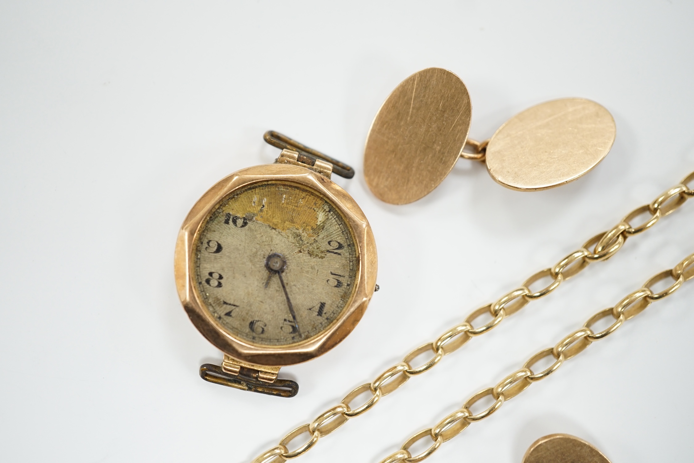 A pair of 9ct gold oval cufflinks, a modern 9ct gold chain, 12.2 grams and a 9ct gold wrist watch (a.f.).